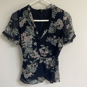 Women’s beautiful floral wrap top.Black and Green